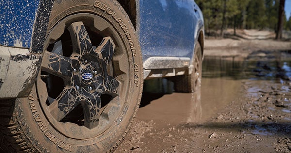 A close-up of the 17-inch off-road wheels and all-terrain Yokohama GEOLANDAR® tires on the 2023 Outback Wilderness.