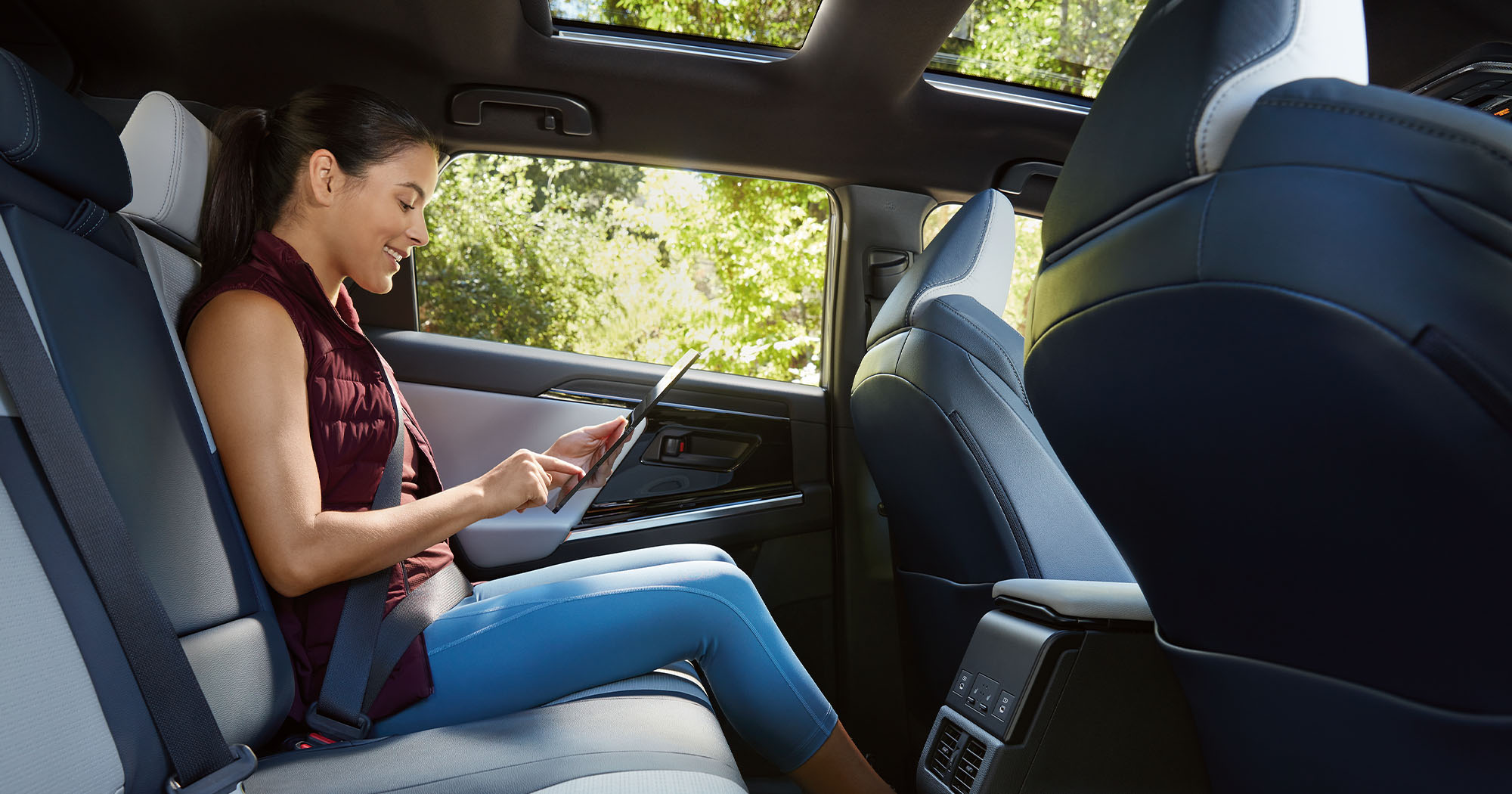  A woman sitting in a rear seat inside the 2023 Solterra.