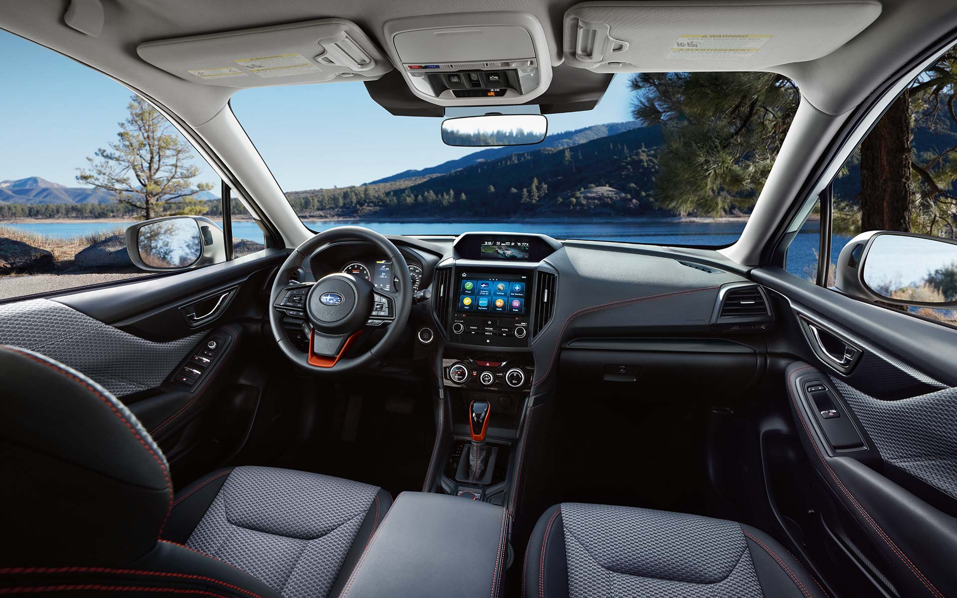 The interior and front dash of the 2022 Forester.