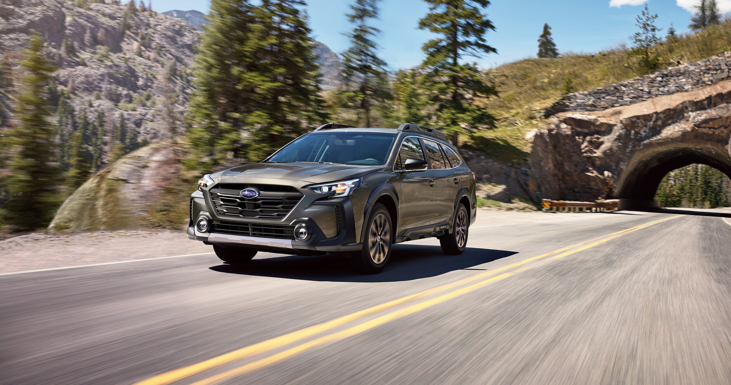 A 2023 Outback driving in the mountains.