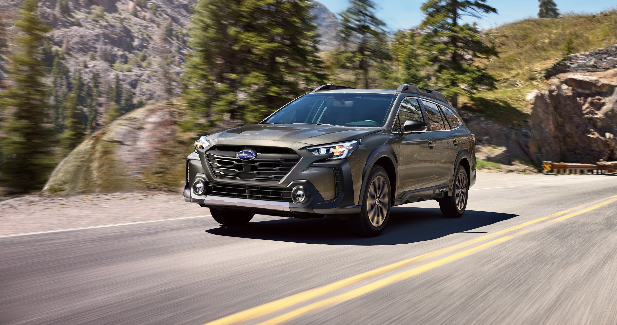A 2023 Outback driving in the mountains.