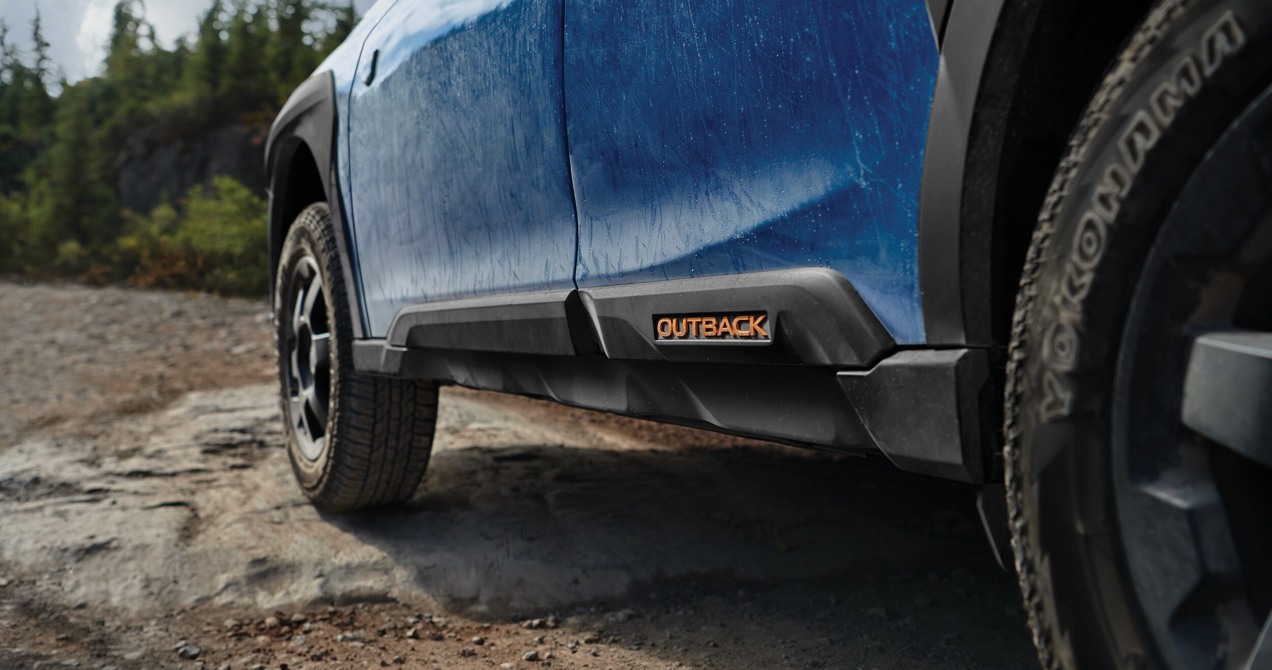 A close-up of the rugged exterior trim and cladding on the 2023 Outback Wilderness.