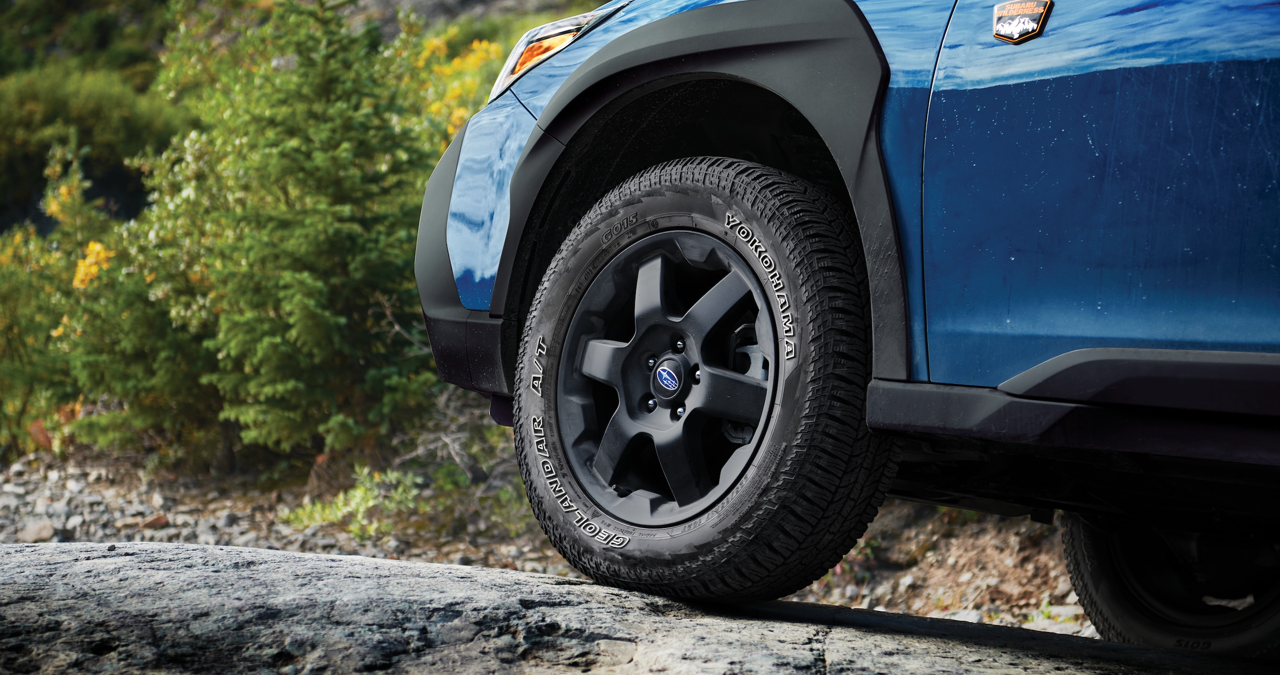A close-up showing the ground clearance of the 2023 Outback Wilderness.
