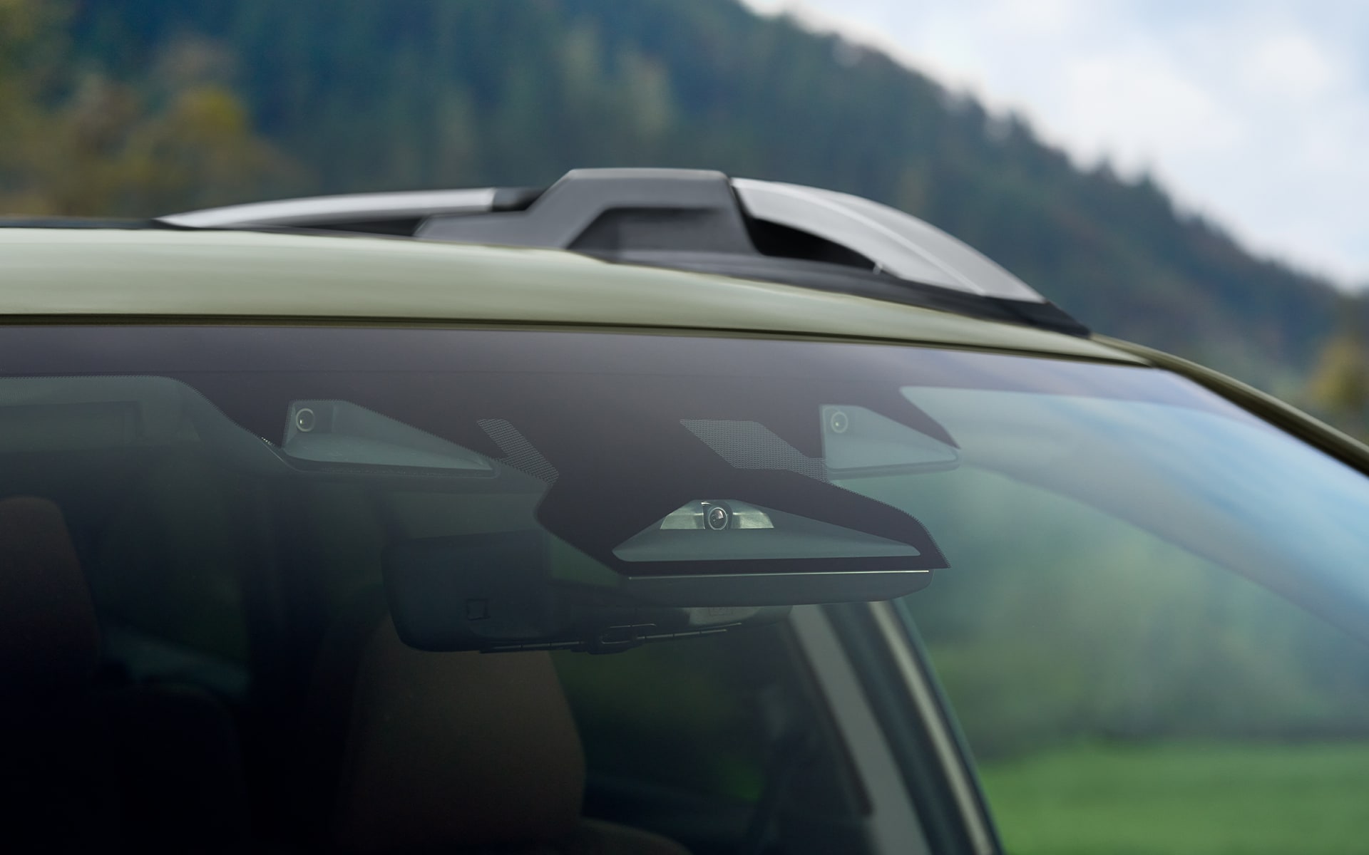 Close-up view of a 2023 Subaru EyeSight camera through front windshield. 