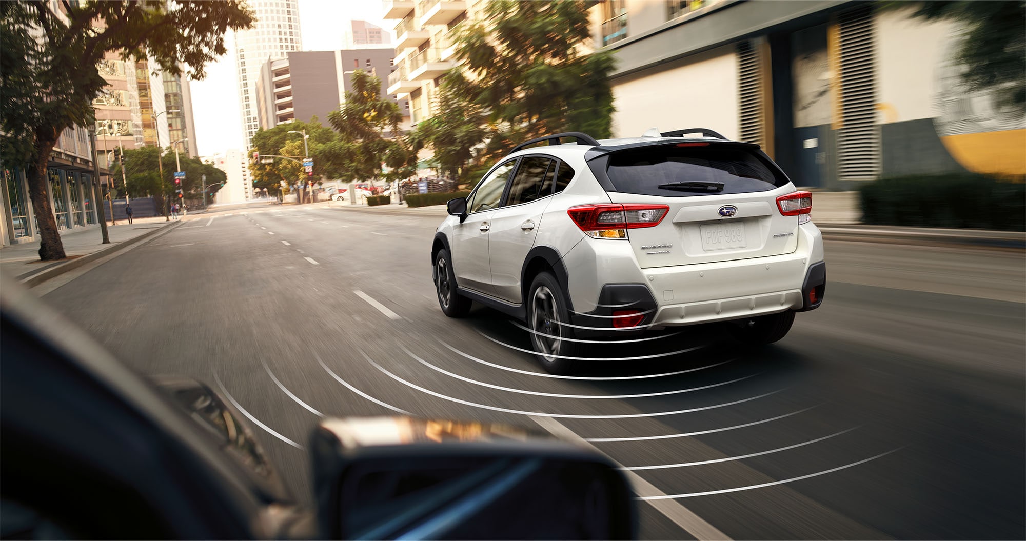  A photo illustration showing the available Blind-Spot Detection feature on the 2023 Crosstrek.