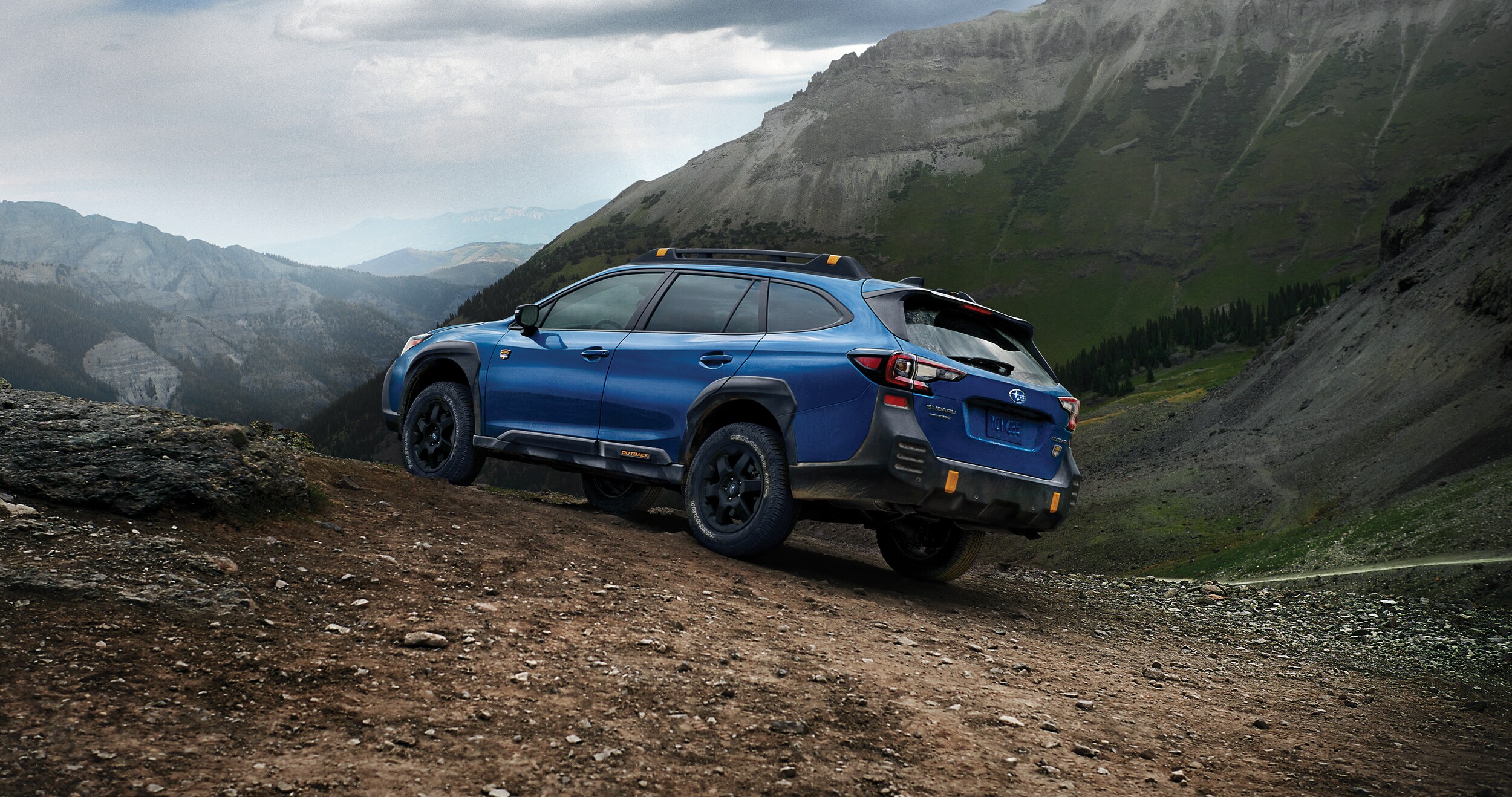 A 2023 Outback Wilderness parked in the mountains.