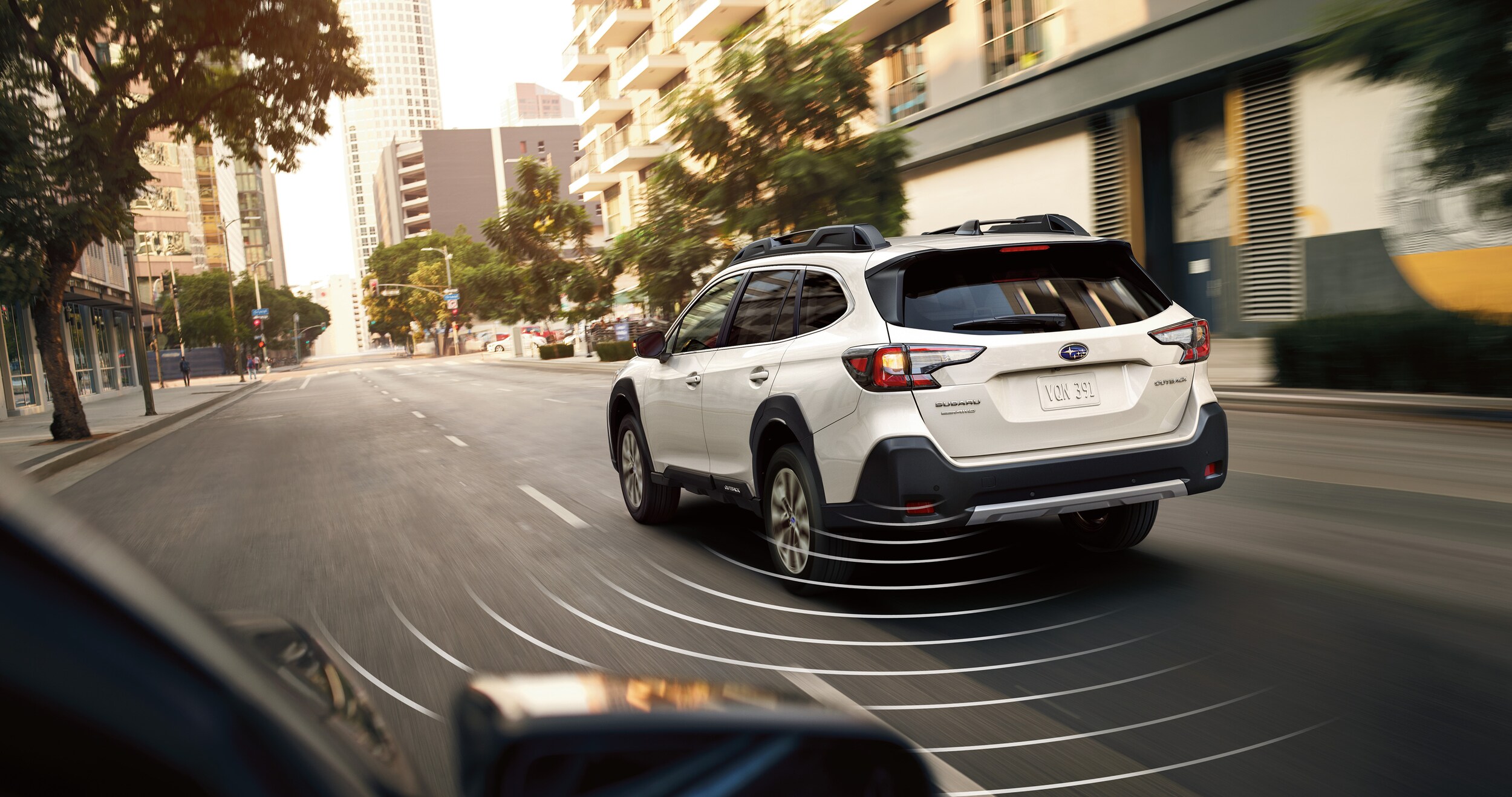 A photo illustration showing the Blind-Spot Detection feature available on the 2023 Outback.