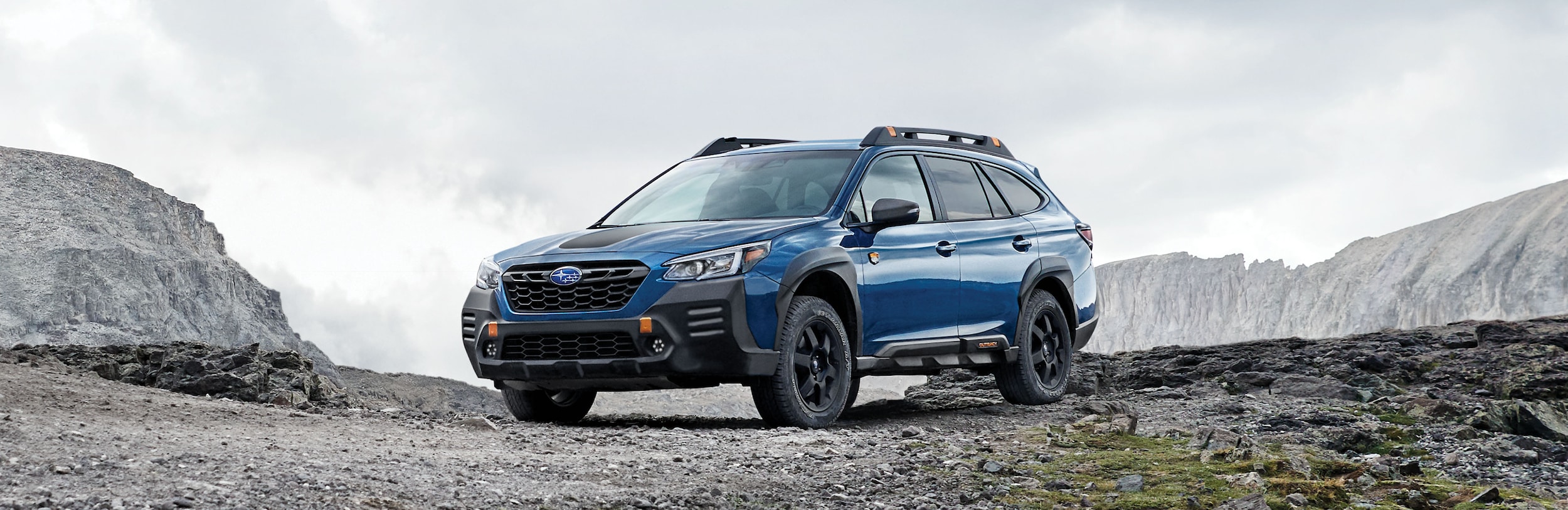 A 2023 Outback Wilderness parked in the mountains.