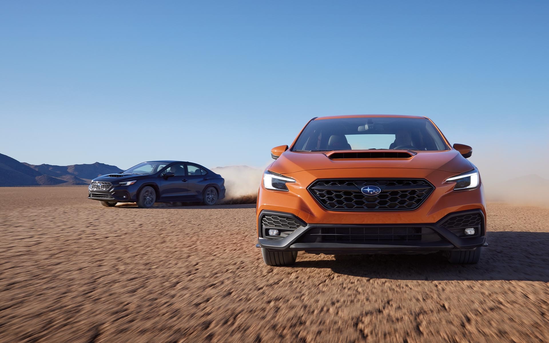 The 2022 Subaru WRX driving down a desert highway. 