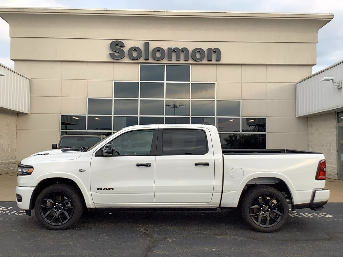 2026 Ram 1500 LARAMIE CREW CAB 4X4 5'7 BOX Bright White at Solomon CJD Brownsville