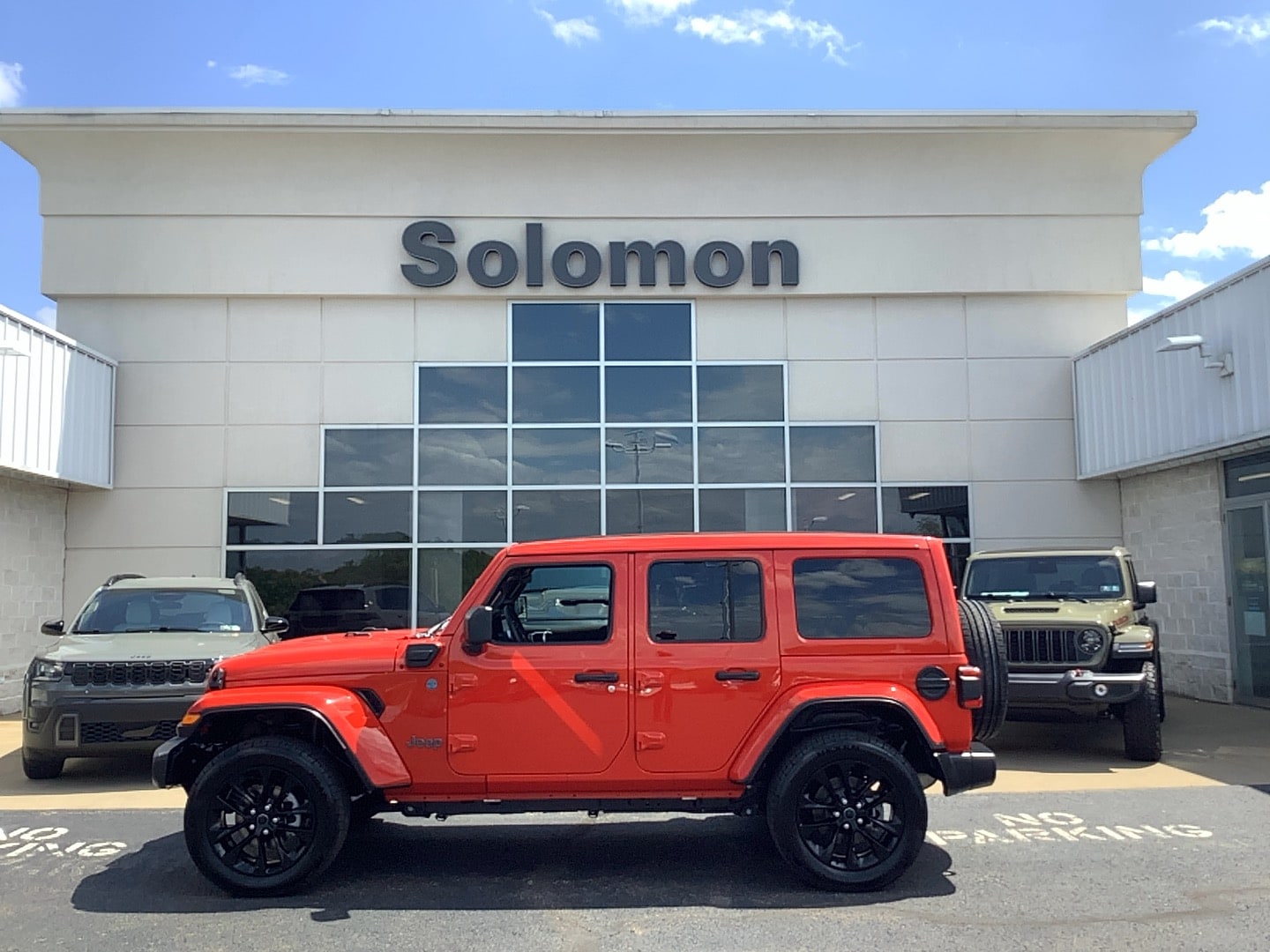 2025 Jeep Wrangler 4xe Sahara Firecracker Red Clearcoat at Solomon CJD Brownsville