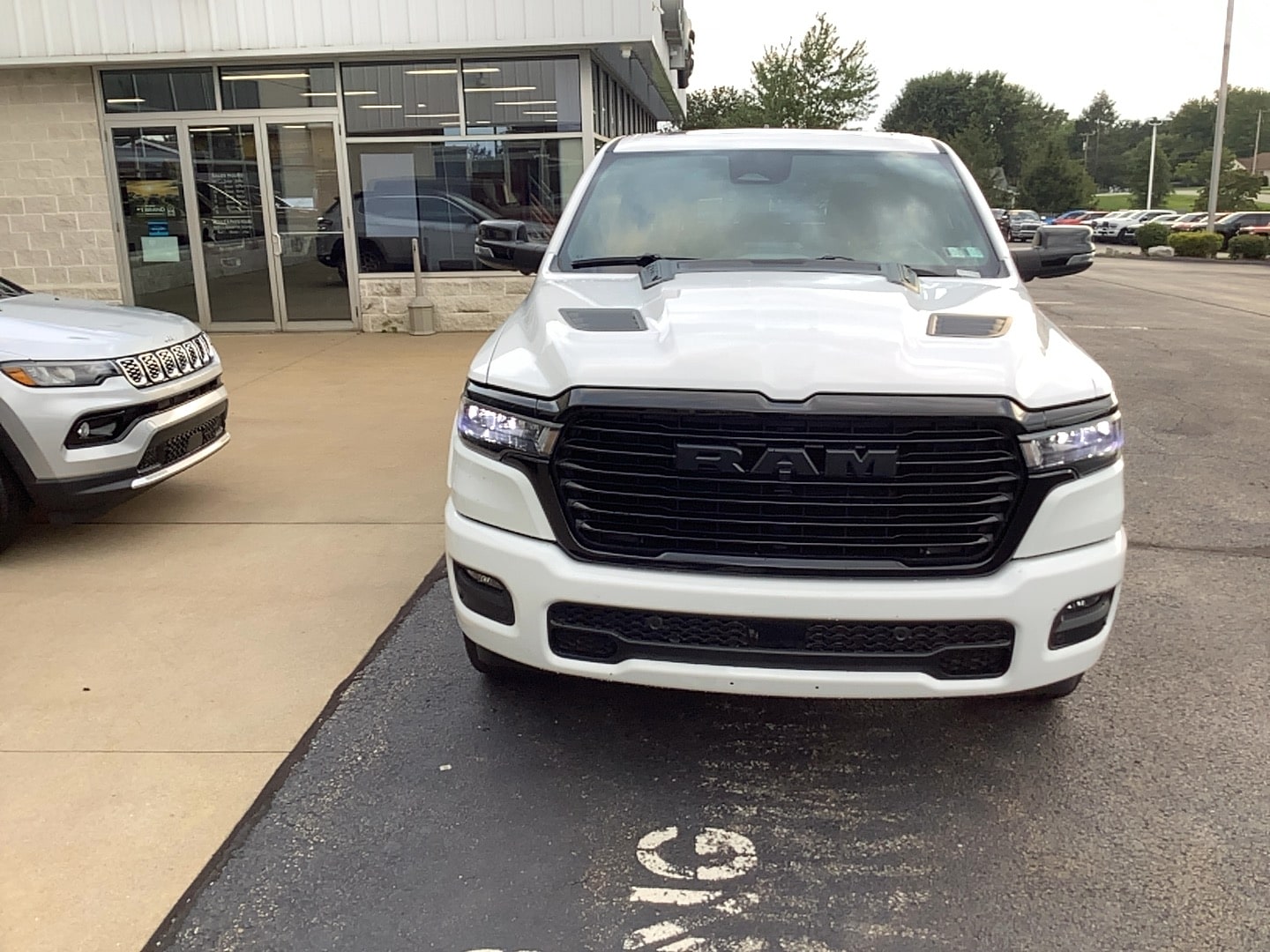 2026 Ram 1500 LARAMIE CREW CAB 4X4 5'7 BOX Bright White at Solomon CJD Brownsville