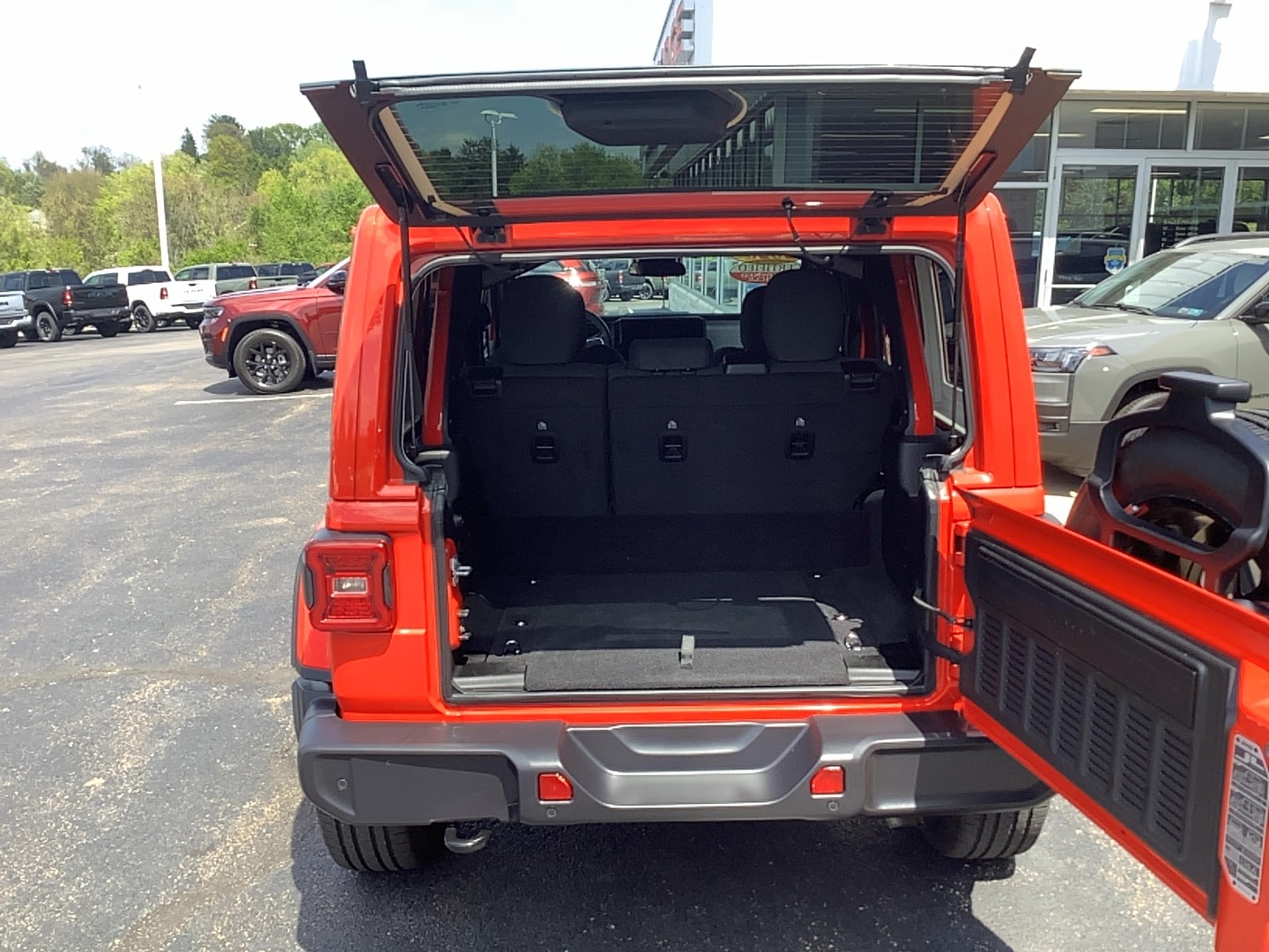 2025 Jeep Wrangler 4xe Sahara Firecracker Red Clearcoat at Solomon CJD Brownsville