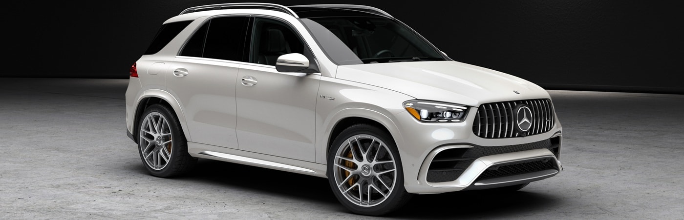 White AMG GLE SUV parked in a warehouse