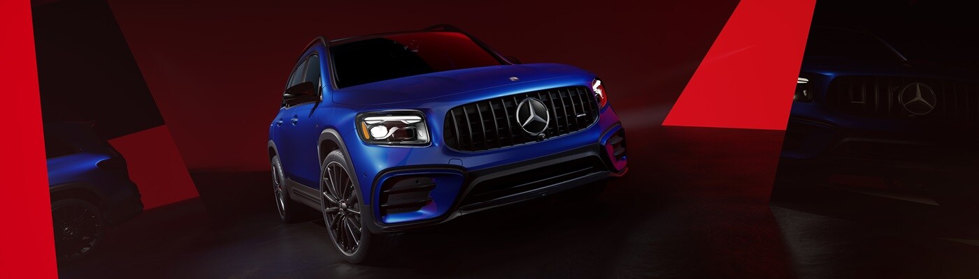 Mercedes-AMG® GLB Blue Mercedes-Benz AMG GLB parked in a black and red modern space