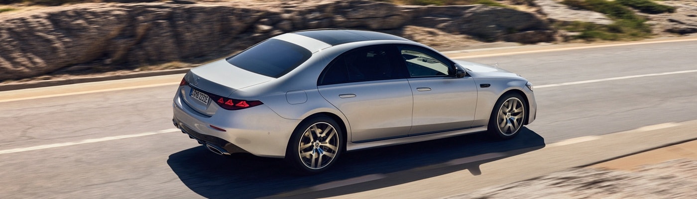 Silver Mercedes-Benz S-Class driving on a desert road