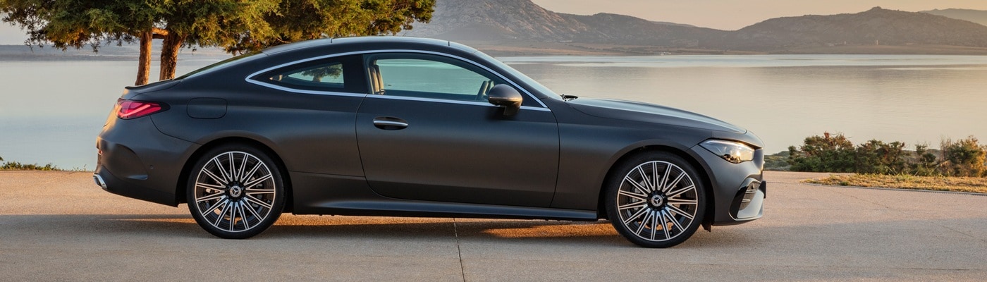 Grey Mercedes-Benz CLE-Class parked by a lake