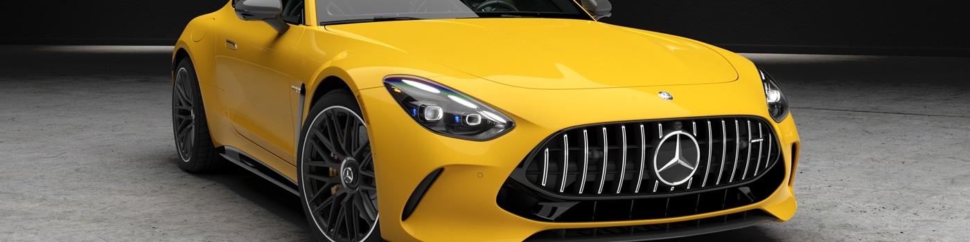 Yellow Mercedes-Benz AMG GT 2-Door Coupe parked in a warehouse
