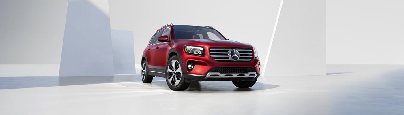 Red Mercedes-Benz GLB parked in a white modern void