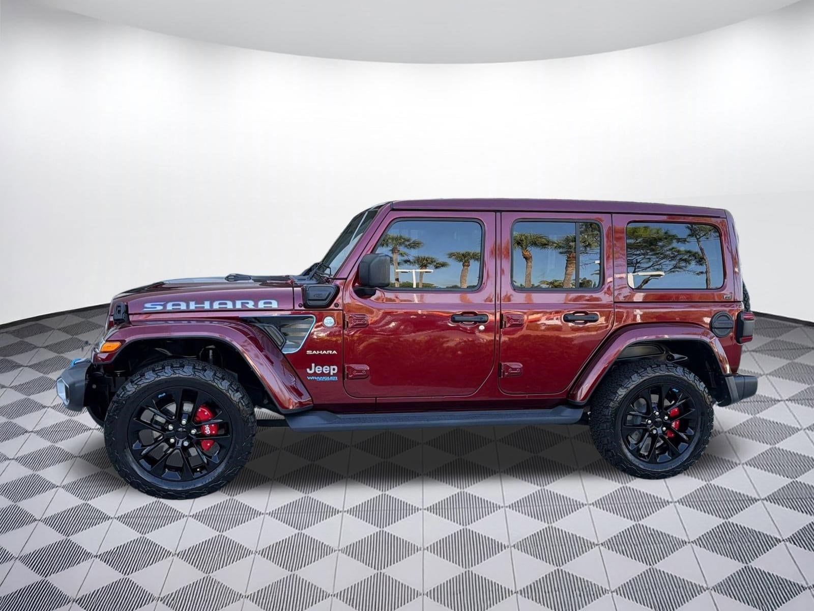 Used 2021 Jeep Wrangler Unlimited Sahara 4XE with VIN 1C4JJXP60MW675550 for sale in Fort Myers, FL