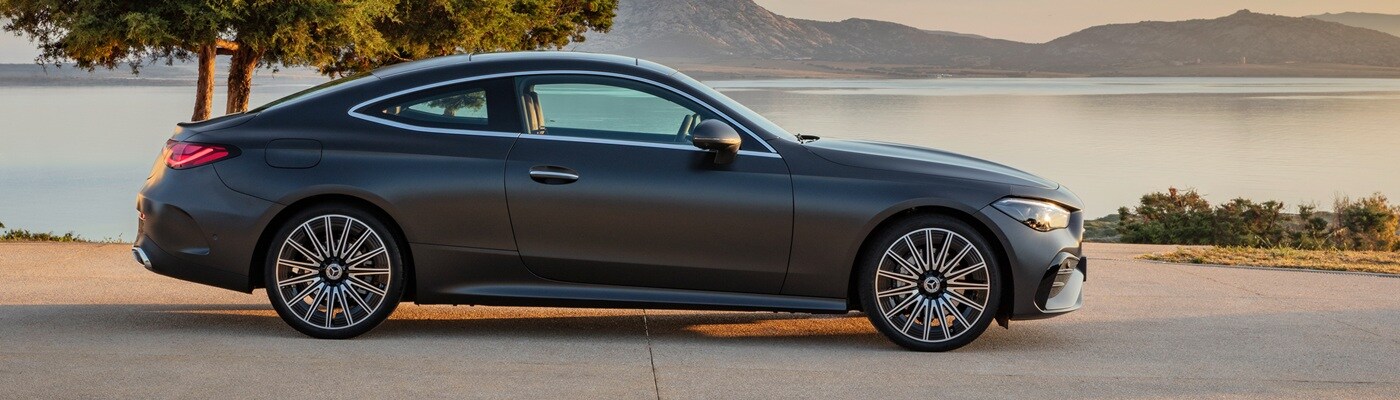 Grey Mercedes-Benz CLE-Class parked by a lake