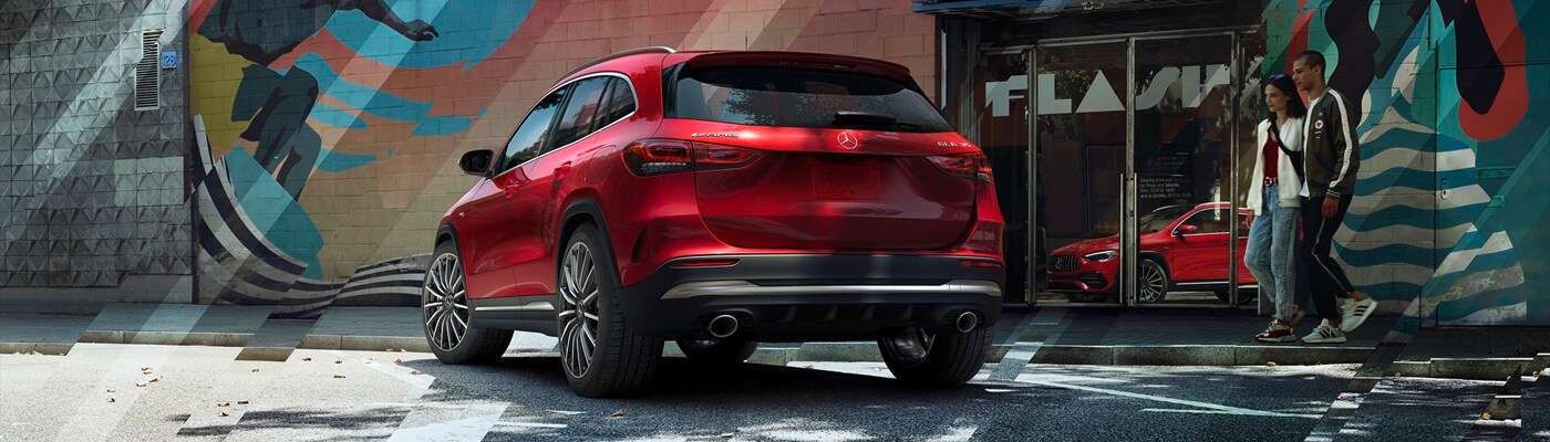 Red Mercedes-Benz AMG GLA 35 parked in a city