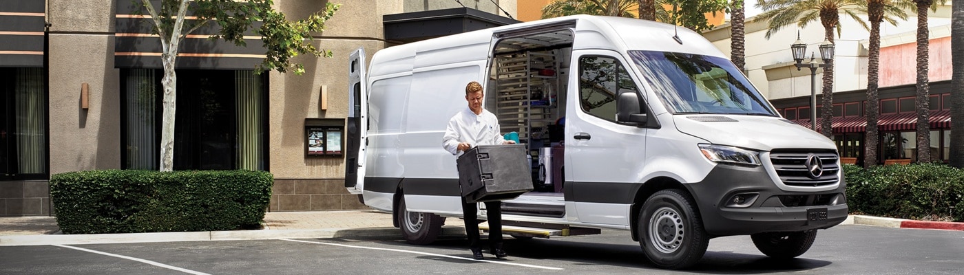 Mercedes-Benz Sprinter parked in front of a restaurant