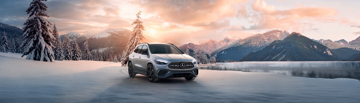 Silver Mercedes-Benz GLA SUV parked in a snowscape
