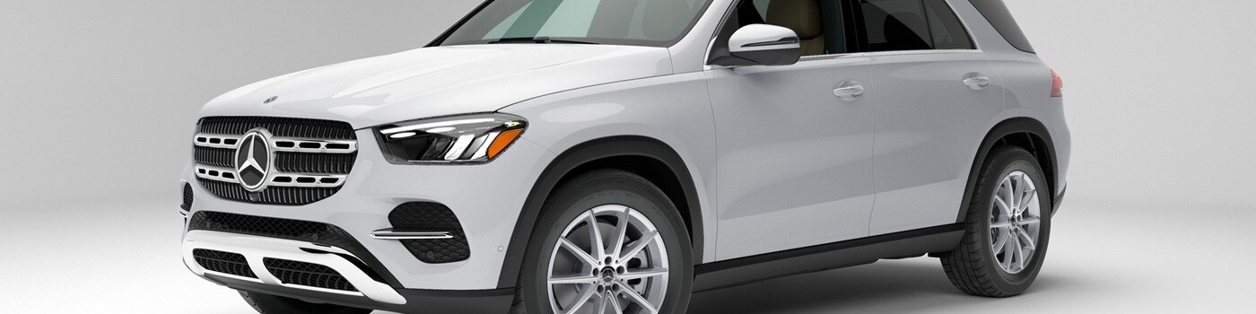 White Mercedes-Benz GLE SUV parked in a white space