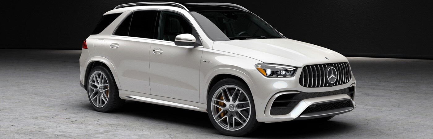 White Mercedes-Benz AMG GLE SUV parked in a concrete space