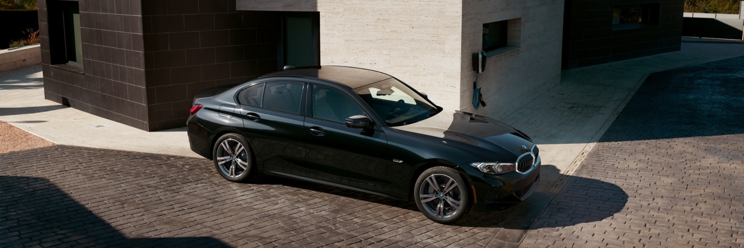 2024BMW 3 Series PHEV parked outside a building