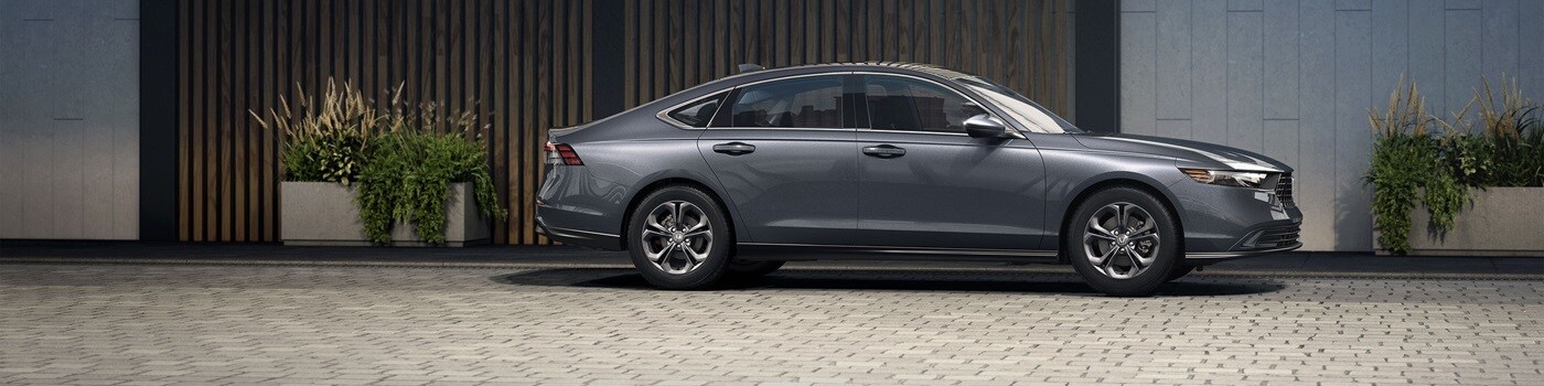 Honda Accord Grey Honda Accord SE parked near a modern house