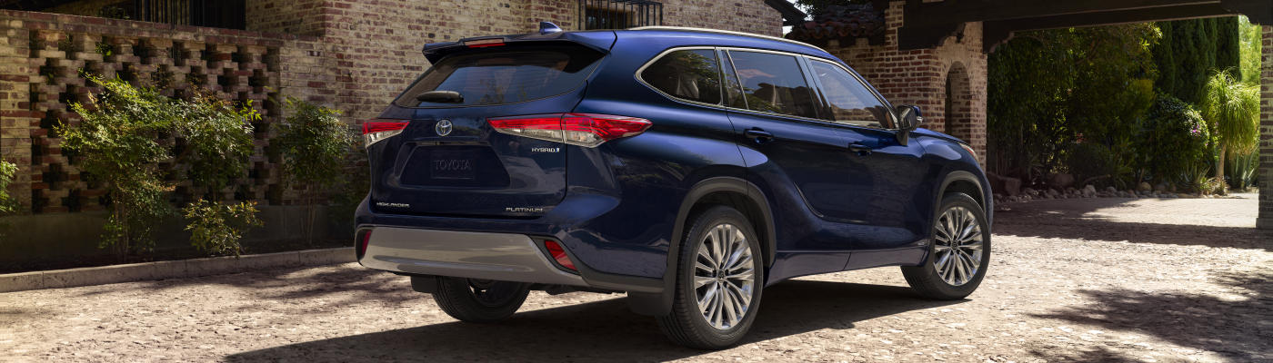 Blue Toyota Highlander Hybrid Platinum parked