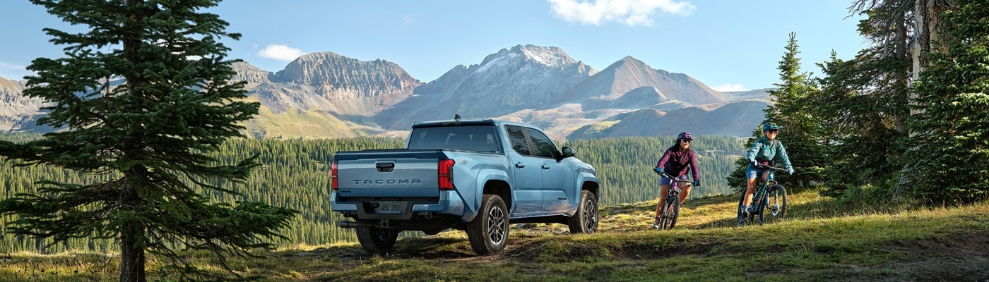Blue Toyota Tacoma TRD Sport parked out in a forest