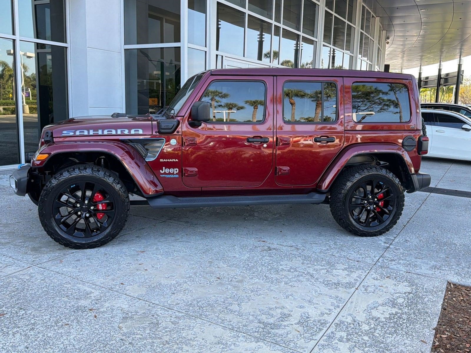 Used 2021 Jeep Wrangler Unlimited Sahara 4XE with VIN 1C4JJXP60MW675550 for sale in Clearwater, FL