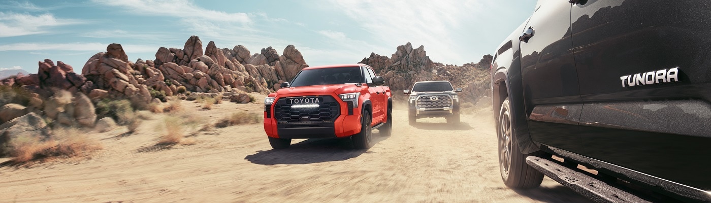 Toyota Tundra models driving in the desert