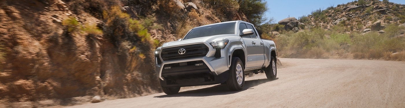 Silver Toyota Tacoma SR5 driving in the desert