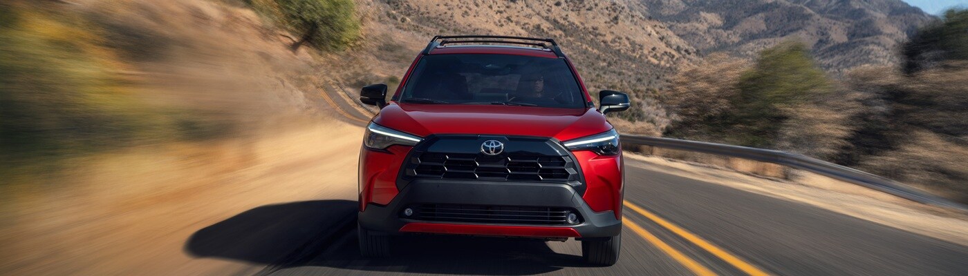 Red Toyota Corolla Cross XLE driving in the desert