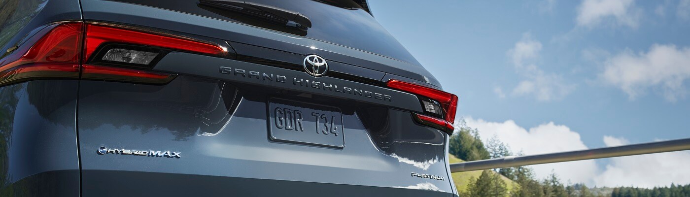 Blue Toyota Grand Highlander Hybrid parked in the sun