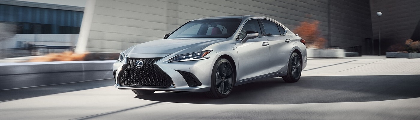 Silver Lexus ES driving in the city