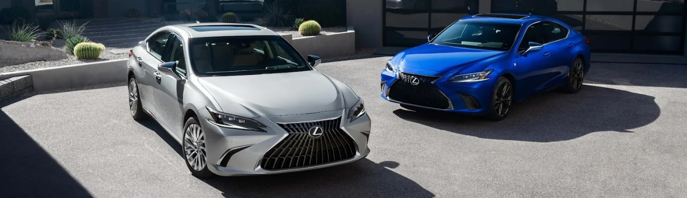 Two Lexus ES parked by a modern house