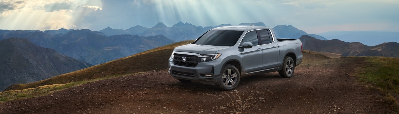 Honda Ridgeline Silver Honda Ridgeline RTL parked on a mountain top