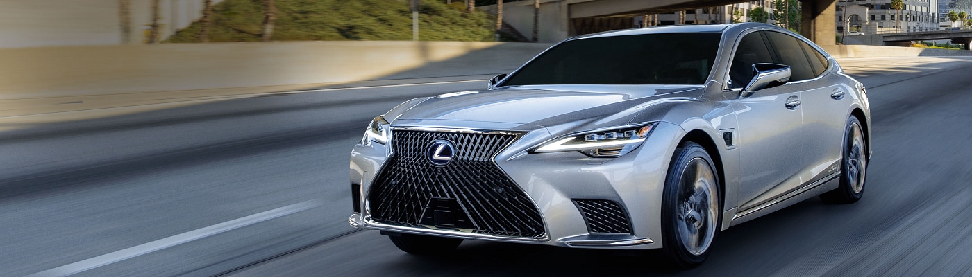 2023 Lexus LS 500 driving on a city freeway