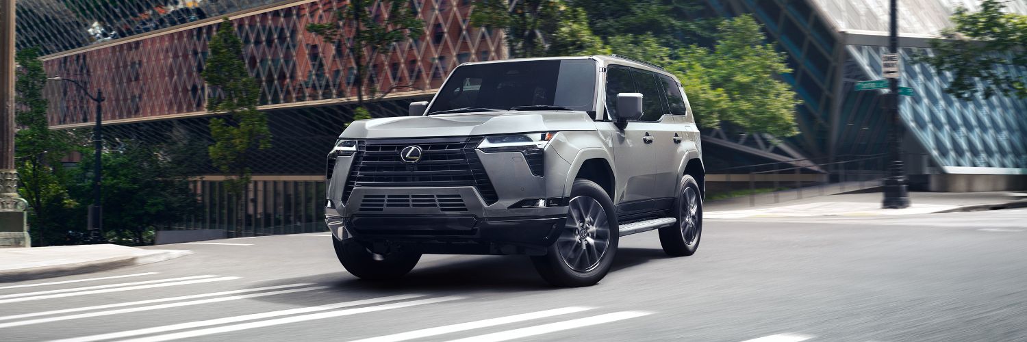 Gray Lexus GX 550 turning onto a city street