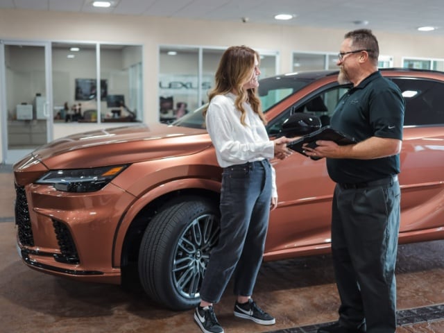 Lexus of Serramonte Service Center Customer and Lexus Service Technician discuss at Lexus of Serramonte Service Center