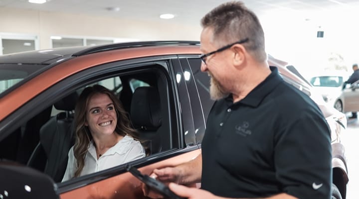 Customer and Lexus Service Technician discuss services at Lexus of Serramonte Service Center