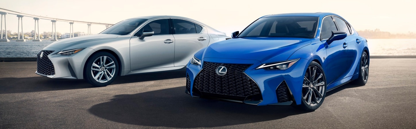 Two 2024 Lexus IS models in front of a waterway