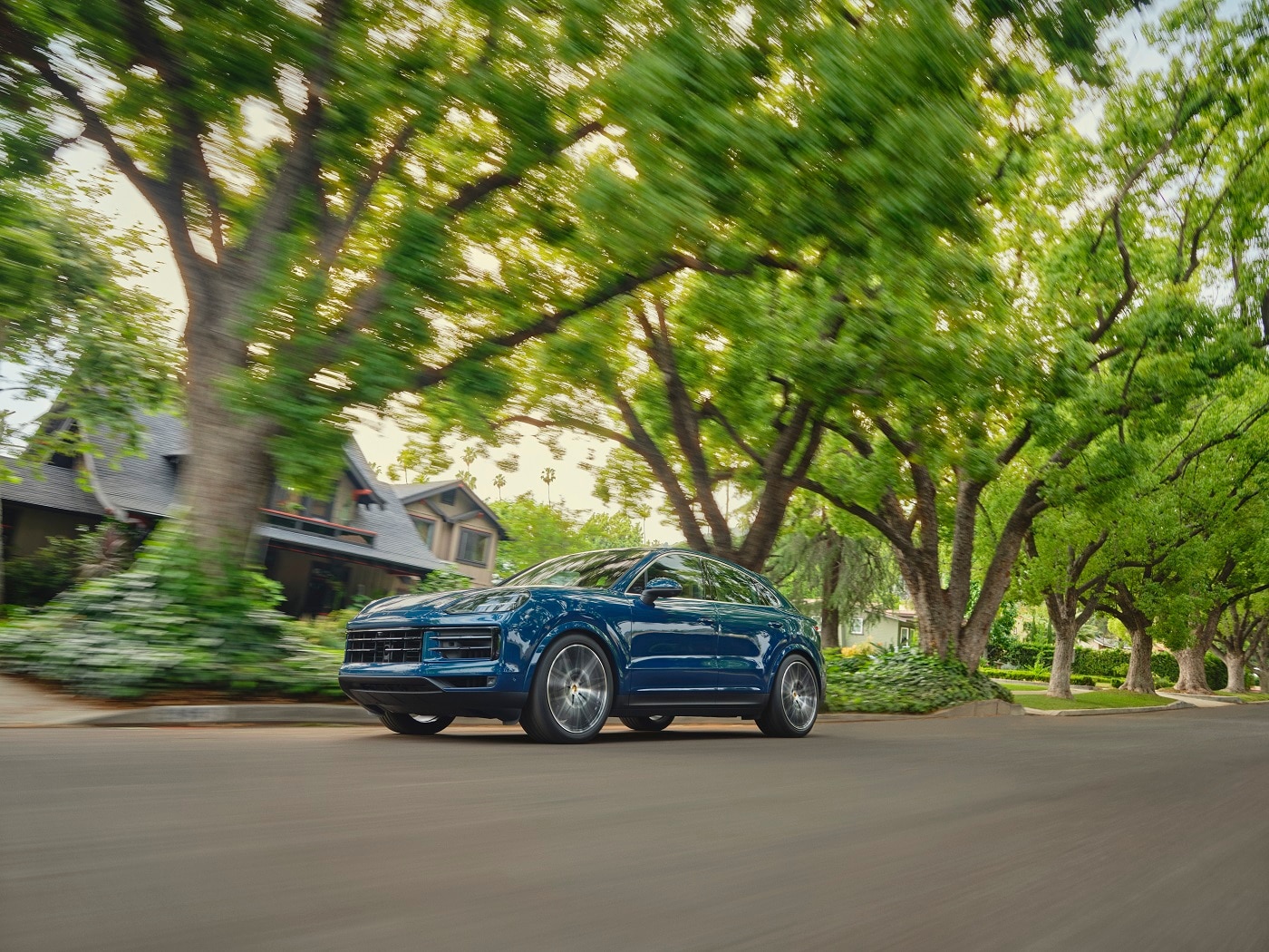 Porsche Cayenne Coupe Porsche Cayenne Coupe driving in the suburbs