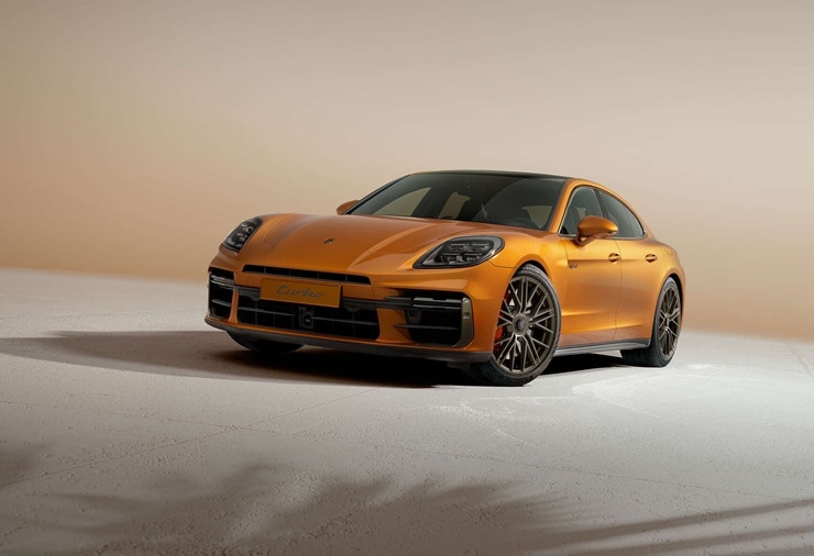 Porsche Panamera Turbo Orange Porsche Panamera Turbo parked in a beige void