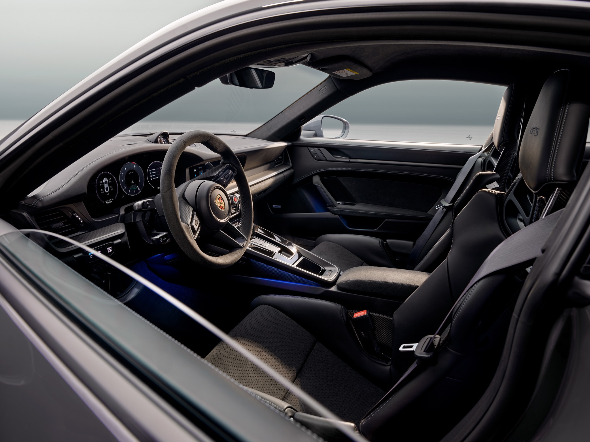Porsche 911 interior Porsche 911 interior from the perspective of the driver's window